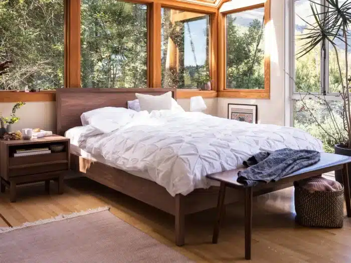 oak platform bed in wood paneled bedroom ORIGINAL