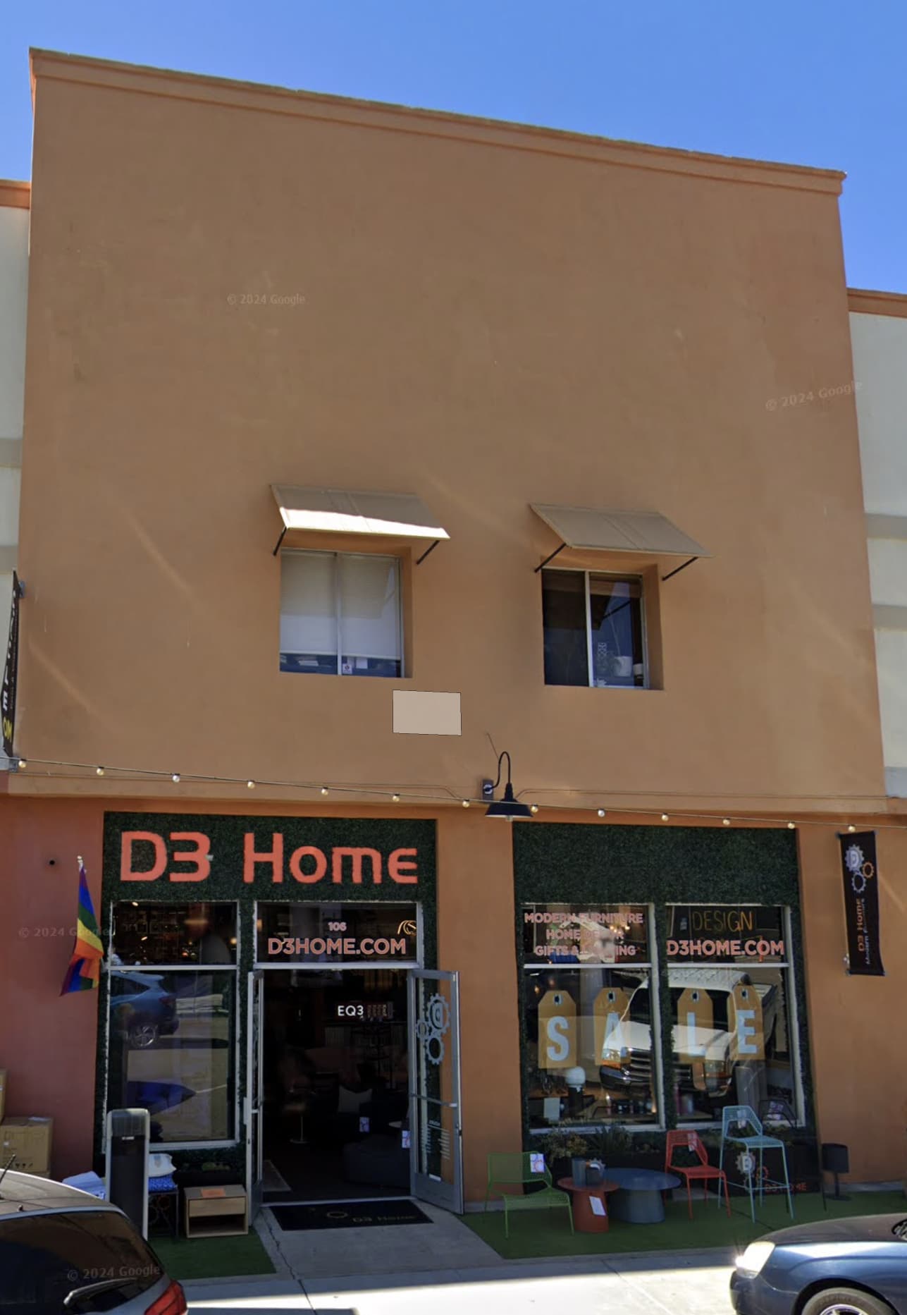 D3 Home Modern Furniture in Little Italy storefront photo of tan two-story building.